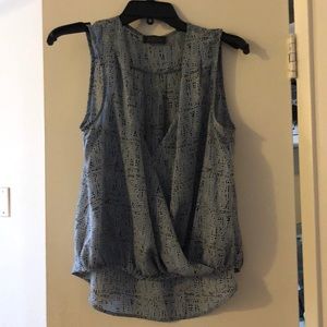 Black and blue polka dot ASTR top